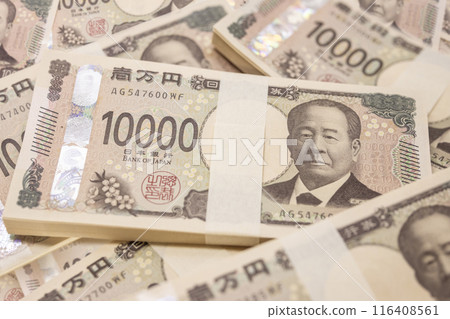 A close-up of Japan's new 10,000 yen note tied together with a sash A close-up of Japan's new 10,000 yen note tied together with a sash 116408561