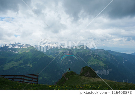 Spectacular trails in the Swiss Alps. Paragliding 116408878