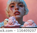 Girl with the ice cream.  Girl in her twenties with white short hair poses with ice cream. 116409207
