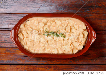 homemade chicken stroganoff in ceramic bowl on rustic wooden table 116409738