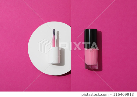 Nail polish brush with nail polish on a pink background Nail polish brush with nail polish on a pink background 116409918