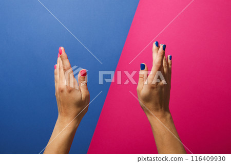 Blue and pink manicure on female hands 116409930