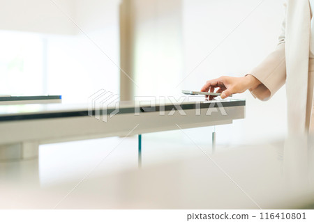 Hands of a person passing through a security gate Hands of a person passing through a security gate 116410801