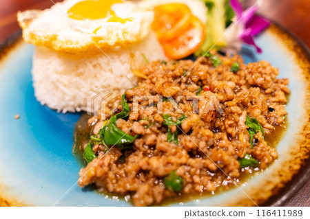 Pad Kapao Gai (Gapao rice) eaten in Southeast Asia and Thailand 116411989