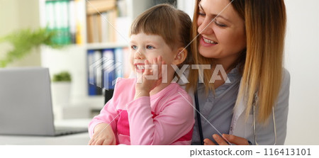 Cute little girl visiting family doctor office 116413101
