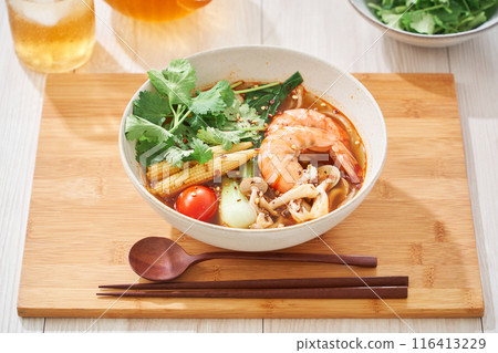 A hearty spicy soup made with glass noodles and topped with shrimp and other ingredients. A hearty spicy soup made with glass noodles and topped with shrimp and other ingredients. 116413229