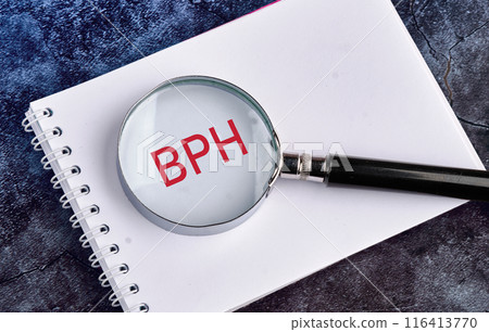 BPH Benign Prostatic Hyperplasia. BPH written through a magnifying glass on a blank piece of notebook BPH Benign Prostatic Hyperplasia. BPH written through a magnifying glass on a blank piece of notebook 116413770