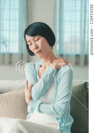 Image of stiff shoulders of a woman in her 50s Image of stiff shoulders of a woman in her 50s 116414298