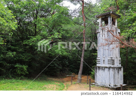 An old white tower standing in the mountains An old white tower standing in the mountains 116414982