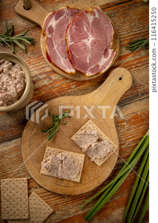 Two crackers topped with savory ham pate 116415250