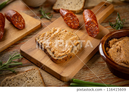 Sausage spread on a slice of bread 116415609