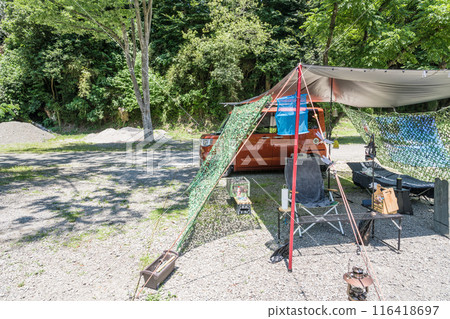 [Auto camping site: Tarp set up in the woods, hanging net] 116418697