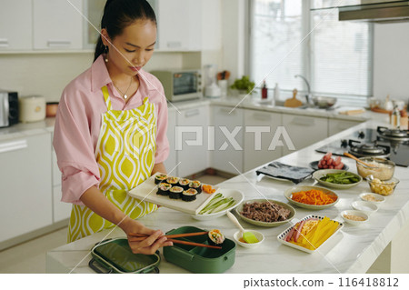 Housewife Putting Kimbap In Lunchbox 116418812
