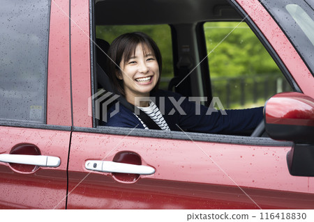 Cute woman driving 116418830