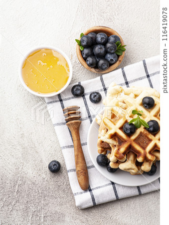 Waffles with blueberries on tables Waffles with blueberries on tables 116419078