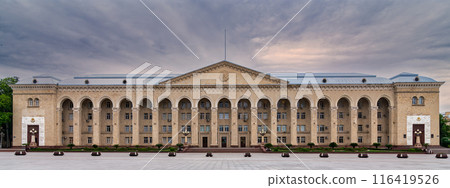 Wide shot of Ganja City Hall, Azerbaijan, a large beige building with arched facade, many windows, central entrance Wide shot of Ganja City Hall, Azerbaijan, a large beige building with arched facade, many windows, central entrance 116419526
