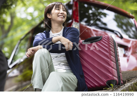 Woman traveling by car 116419990