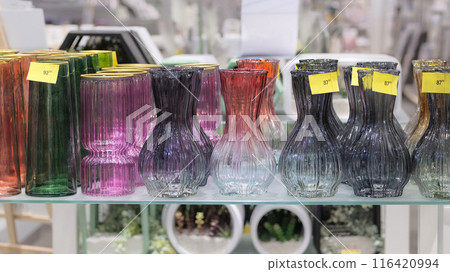 Variety of glass flower jars are sold in store. Vases for flowers. Variety of glass flower jars are sold in store. Vases for flowers. 116420994