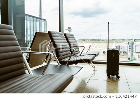 Vacant airport seats, luggage related to air travel and airport facilities 116421447