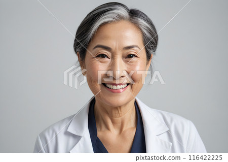 An older Asian female doctor smiling at the camera 116422225