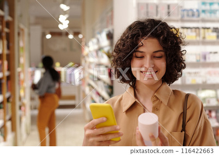 Reading information on jar of cream 116422663