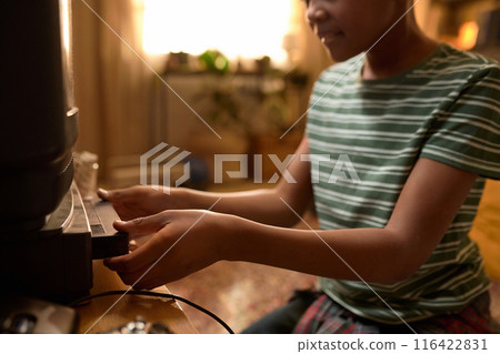 Smiling Boy Loading VHS Tape into VCR Smiling Boy Loading VHS Tape into VCR 116422831