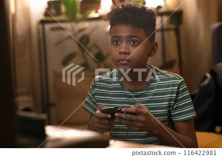 African American Boy Playing Retro Video Game 116422981