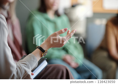 Hand of unrecognizable female counselor Hand of unrecognizable female counselor 116423050