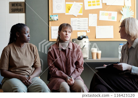 Woman describing her problem at session Woman describing her problem at session 116423120