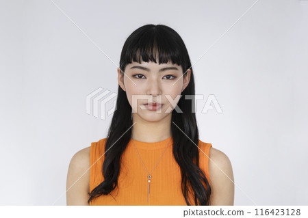 A young woman looking at the camera 116423128