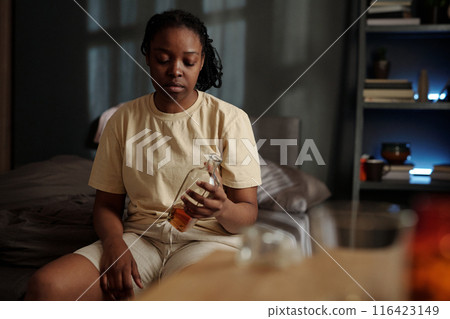 Young sad woman addicted to alcohol 116423149
