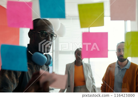 Discussing Ideas During Office Planning Session 116423800