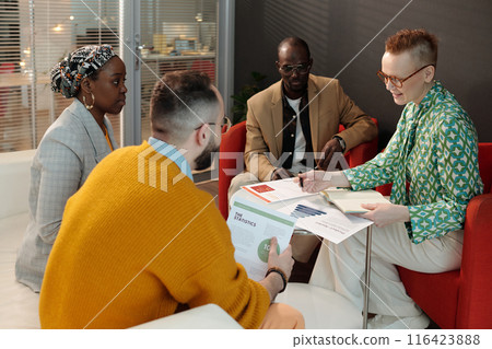 Diverse Group Discussing Business Statistics in Office Diverse Group Discussing Business Statistics in Office 116423888