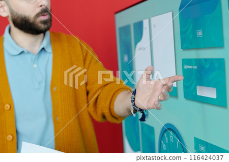 Close-Up of Businessman Explaining Presentation on Screen 116424037