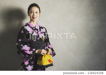 Woman in black yukata Woman in black yukata 116424108