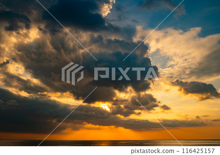 Landscape Long exposure of majestic clouds in the sky sunset or sunrise over sea with reflection in the tropical sea.Beautiful cloudscape scenery.Amazing light of nature Landscape nature background Landscape Long exposure of majestic clouds in the sky sunset or sunrise over sea with reflection in the tropical sea.Beautiful cloudscape scenery.Amazing light of nature Landscape nature background 116425157