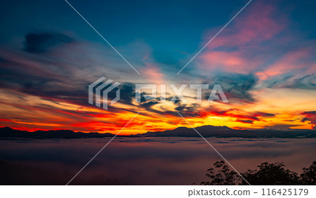 Landscape of majestic clouds in the sky sunset or sunrise over mountains with fog.Beautiful landscape scenery.Amazing light of nature Landscape nature background 116425179
