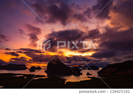 Landscape Long exposure of majestic clouds in the sky sunset or sunrise over sea with reflection in the tropical sea.Beautiful cloudscape scenery.Amazing light of nature Landscape nature background 116425181