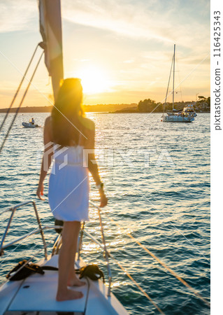 Young woman sailing, young adult lady enjoying summer travel, close-up portrait of female face, summer cruise holidays, European girl tourist traveling in sail boat in Croatia Young woman sailing, young adult lady enjoying summer travel, close-up portrait of female face, summer cruise holidays, European girl tourist traveling in sail boat in Croatia 116425343