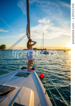 Young woman sailing, young adult lady enjoying summer travel, close-up portrait of female face, summer cruise holidays, European girl tourist traveling in sail boat in Croatia Young woman sailing, young adult lady enjoying summer travel, close-up portrait of female face, summer cruise holidays, European girl tourist traveling in sail boat in Croatia 116425348