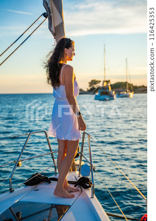 Young woman sailing, young adult lady enjoying summer travel, close-up portrait of female face, summer cruise holidays, European girl tourist traveling in sail boat in Croatia 116425353