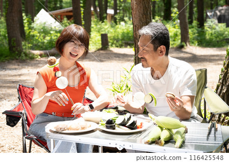 Senior couple having fun at outdoor camping Senior couple having fun at outdoor camping 116425548