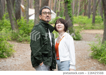 Senior couple having fun at outdoor camping Senior couple having fun at outdoor camping 116425588