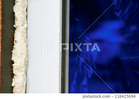 Construction foam. Installation of a metal plastic window,door,brick wall.  116425694