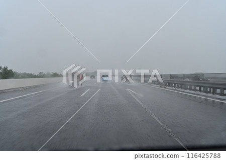 Guerrilla downpour: Heavy rain so heavy you can't see ahead on the highway Guerrilla downpour: Heavy rain so heavy you can't see ahead on the highway 116425788