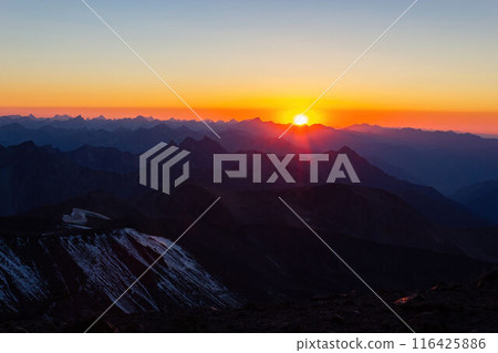 Sunrise over Caucasus Range, peaks bath warm golden light. Dawn, witness majestic mountain view. Serene remote landscapes, beautiful orange sky. Sunrise over Caucasus Range, peaks bath warm golden light. Dawn, witness majestic mountain view. Serene remote landscapes, beautiful orange sky. 116425886