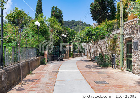 Via Tragara, scenic pedestrian pathway leading to Belvedere Tragara Faraglioni panoramic view area in Capri Island, Italy. 116426092