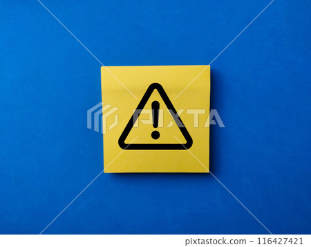 Attention sign,Exclamation mark,warning sign concept., Exclamation mark or Warning sign on yellow sticky note over blue background. 116427421
