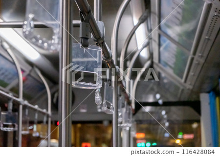 Interior view of the bus with hand grip, in Bangkok, Thailand Interior view of the bus with hand grip, in Bangkok, Thailand 116428084