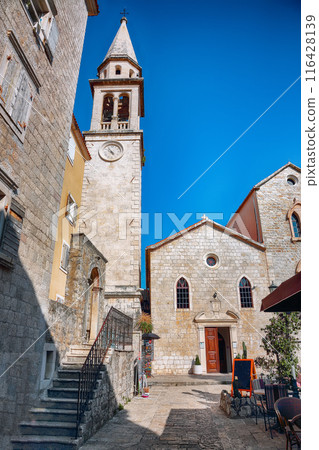 Captivating view on St. Johns Church in Budva old town on a sunny summer day. Captivating view on St. Johns Church in Budva old town on a sunny summer day. 116428139